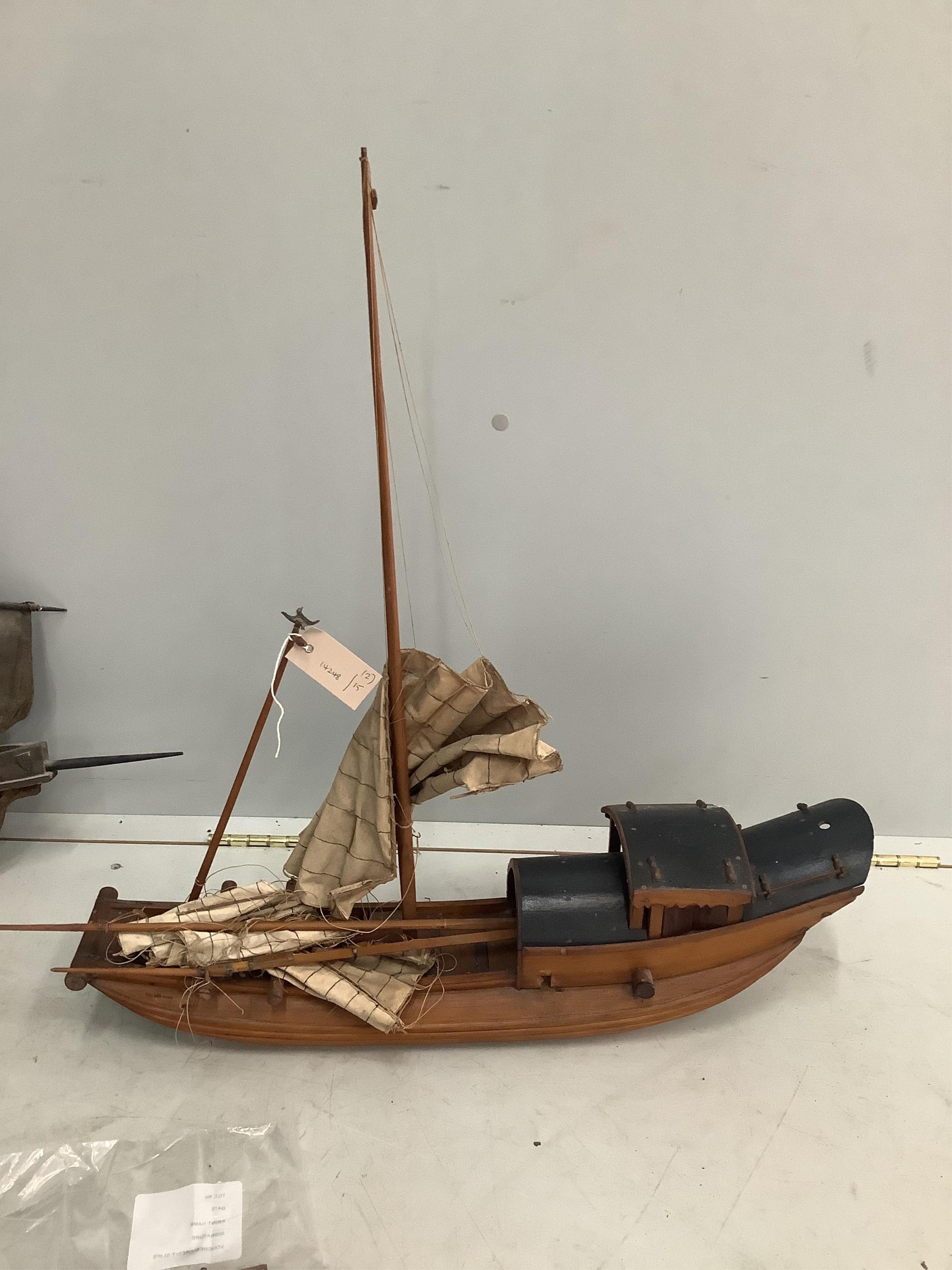Two wooden model boats, larger length 67cm. Condition - poor
